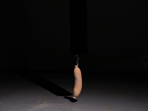 Spotlit wooden sausage